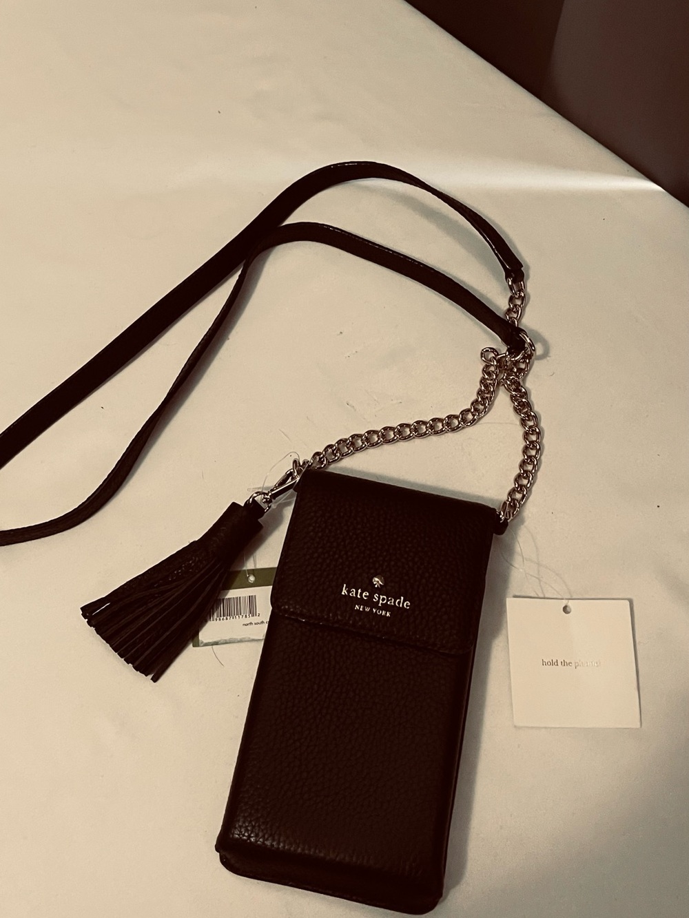 kate spade black pebble leather crossbody phone pouch with tassel